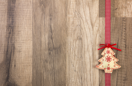Christmas decoration with wood background, Christmas tree red with ribbon の写真素材