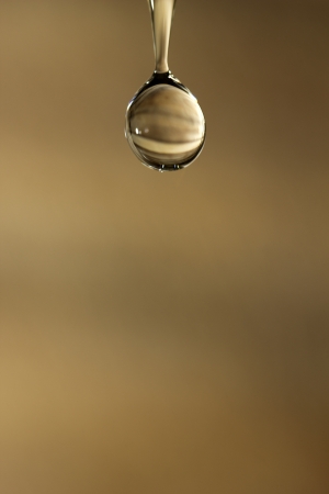 The fluid motion of water splashing as it is poured  の写真素材