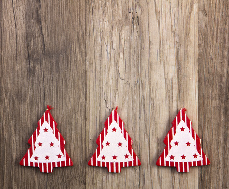 christmas trees red and white on wooden backgroundの写真素材