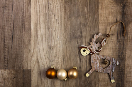 christmas baubles brown, moose on wooden background の写真素材