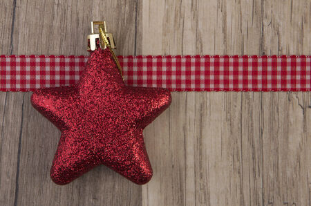 christmas decoration with christmas baubles red on wooden background の写真素材