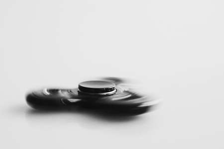 Fidget spinner spinning at high speed. A great sensory toy that helps your child control their emotions.の写真素材