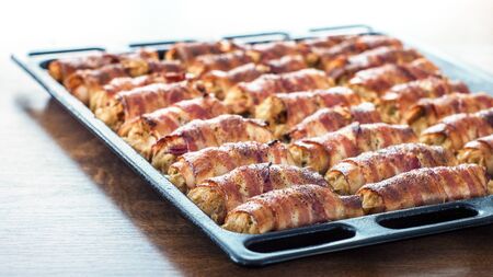 Bacon rolls, stuffed with cabbage and fishの写真素材