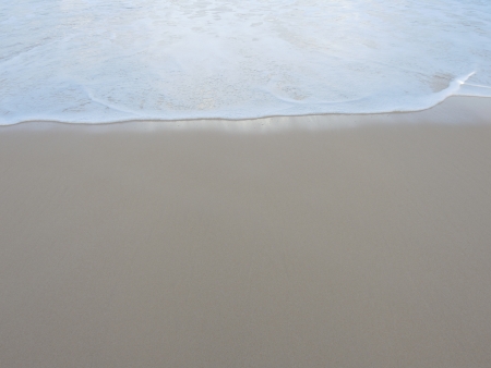 sea foam and sandの写真素材