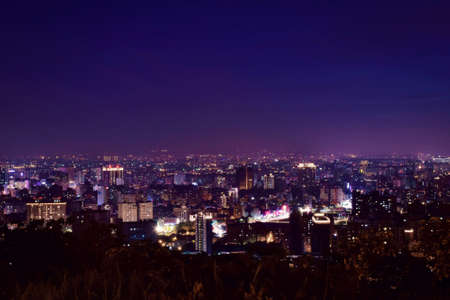Night view of the city from the top of the mountainの写真素材