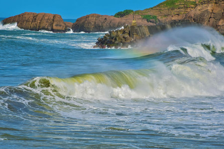 Waves breaking on the coast of Atlantic ocean in Brittany, France