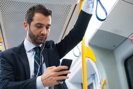 Businessman commuter traveling on the metro underground Businessman commuter traveling on the metro underground
