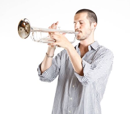 young man playing the trumpetの写真素材