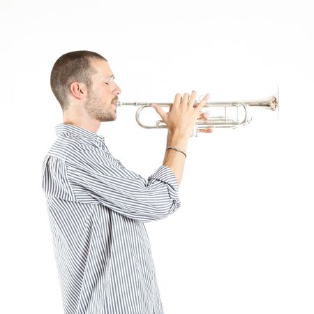 young man playing the trumpetの写真素材