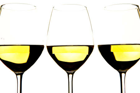 three glasses of white wine on white backgroundの写真素材