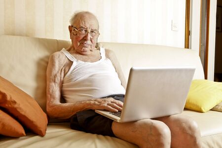 elder man with laptop