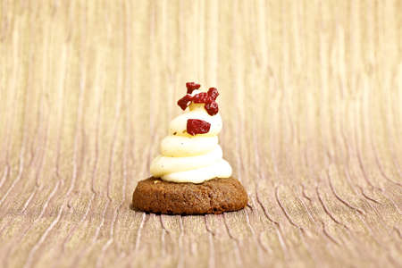 Beautiful little cake on colorful wallpaper backgroundの写真素材