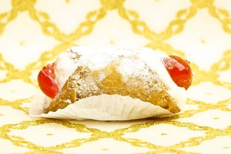 Beautiful little cake on colorful wallpaper backgroundの写真素材