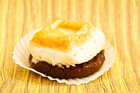 Beautiful little cake on colorful wallpaper backgroundの写真素材