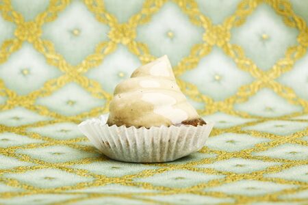 Beautiful little cake on colorful wallpaper backgroundの写真素材