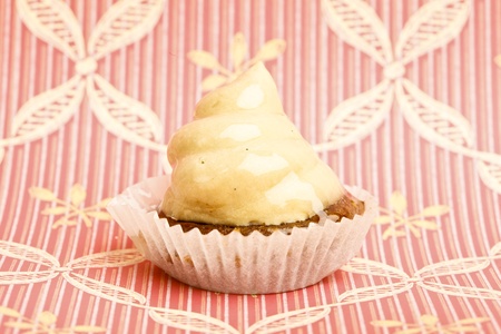 Beautiful little cake on colorful wallpaper backgroundの写真素材