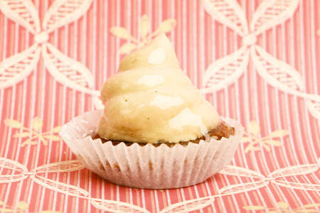 Beautiful little cake on colorful wallpaper backgroundの写真素材