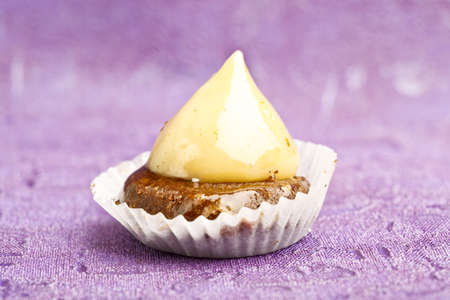 Beautiful little cake on colorful wallpaper backgroundの写真素材