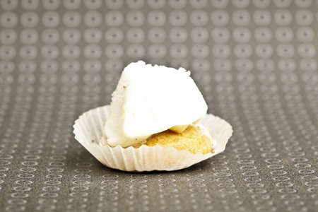 Beautiful little cake on colorful wallpaper backgroundの写真素材
