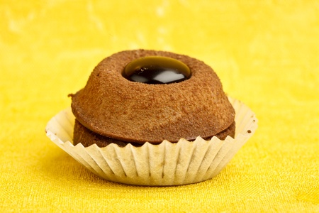 Beautiful little cake on colorful wallpaper backgroundの写真素材