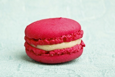 Beautiful little cake on colorful wallpaper backgroundの写真素材