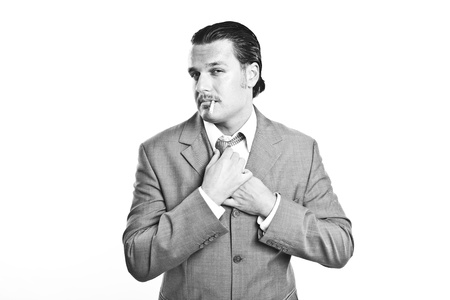portrait of a cool elegant young man smoking a sigaretteの写真素材