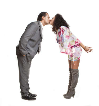 confident elegant couple of young people kissingの写真素材