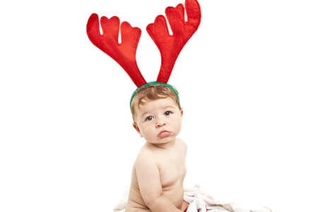 cute little baby with reindeer hatの写真素材