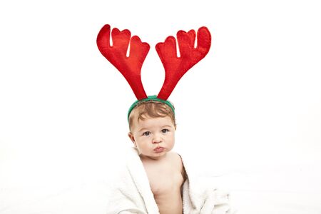 cute little baby with reindeer hatの写真素材