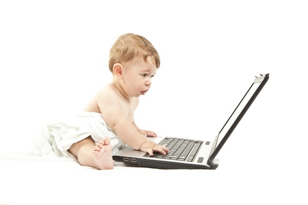 cute little baby using a pcの写真素材