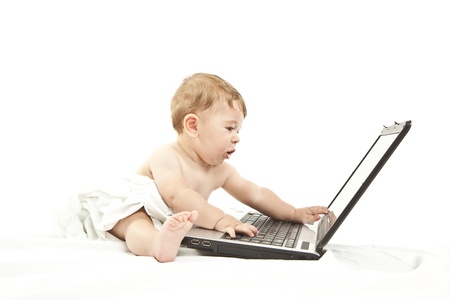 cute little baby using a pcの写真素材