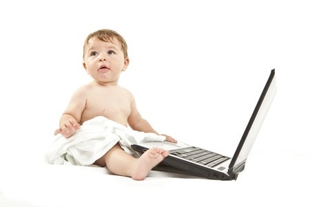 cute little baby using a pcの写真素材