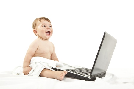 cute little baby using a pcの写真素材
