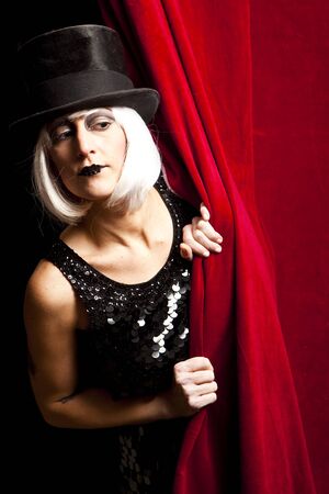 cabaret performer on stage looking at the audience