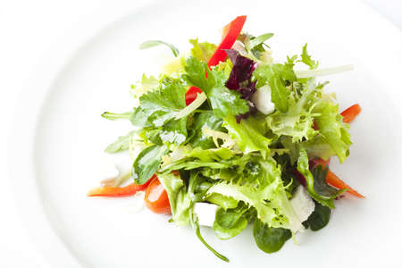 green salad with feta cheese, tomatoes and peppersの写真素材