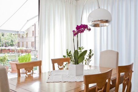 modern dining room with white curtainsの写真素材