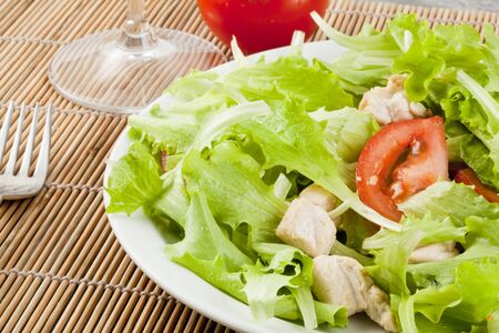 fresh salad with chicken and tomatoesの写真素材