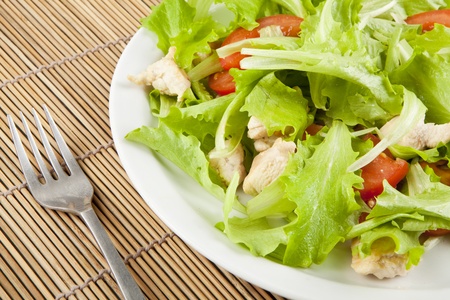 fresh salad with chicken and tomatoesの写真素材