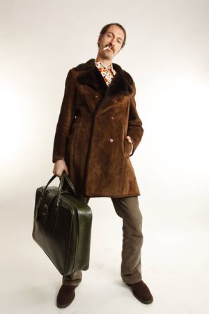 funny vintage young man with suitcaseの写真素材