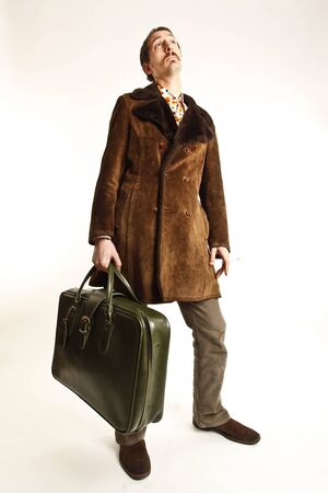 funny vintage young man with suitcaseの写真素材