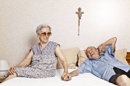 elderly couple in the bedroomの写真素材