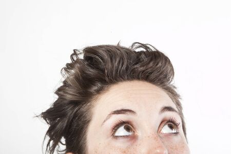 close up portrait of a woman looking upの写真素材
