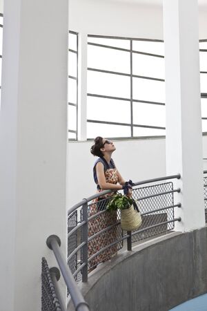 young pretty fashion model at the fruit marketの写真素材