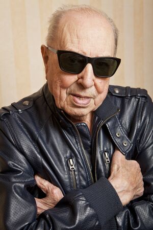 cool fashion elder man with sunglassesの写真素材