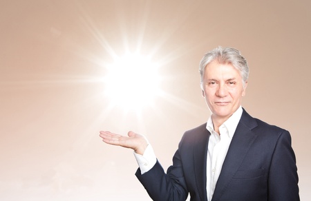 Happy senior businessman with hand gesture showing copyspace onの写真素材