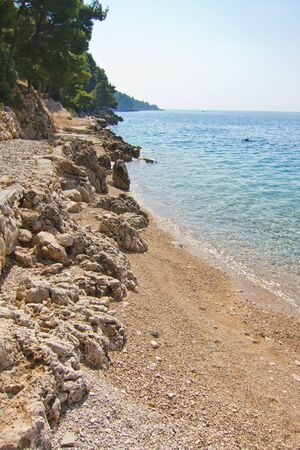 beautiful rocky beach in Brac island, croatiaの写真素材