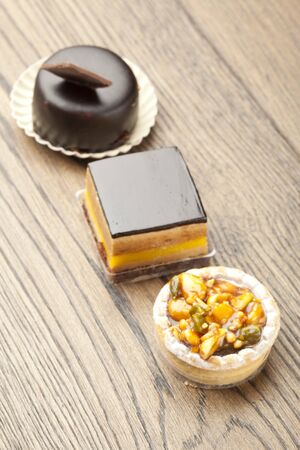 chocolate pastry little cake  on  wooden tableの写真素材
