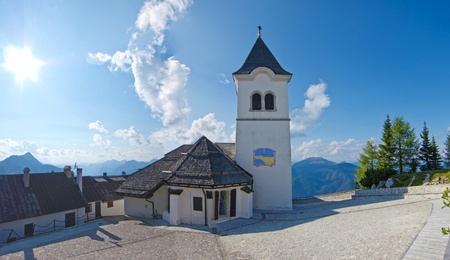 panoramic view of church in monte lussari, small mountain village, italyの写真素材