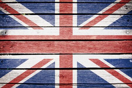 united kingdom flag painted on old wood plank backgroundの写真素材