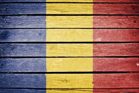 romania, romanian flag painted on old wood plank backgroundの写真素材